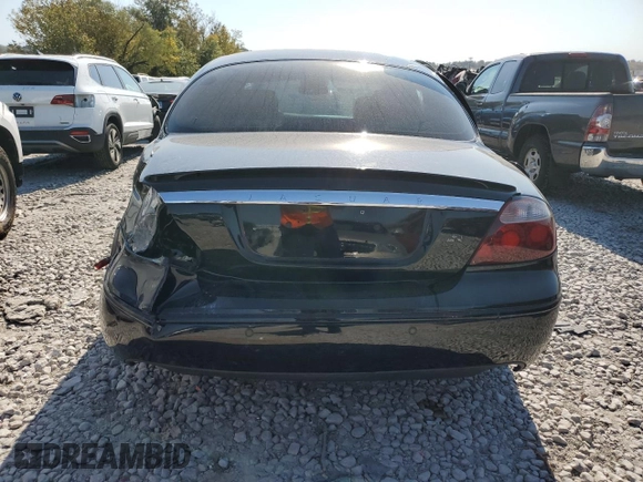 2005 Jaguar S-Type with VIN SAJWA03V251N28012, listed as a Copart auction lot 74417644 with 128,947 mi miles and Salvage Title. Bid and sale history available at DreamBid. Image 6.