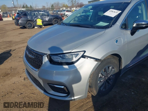 2023 Chrysler Pacifica Hybrid Limited with VIN 2C4RC1S72PR588627, listed as a IAAI auction lot 42063631 with 52,799 mi miles and . Bid and sale history available at DreamBid. Image 6.