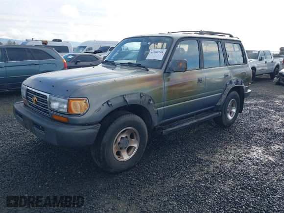 1995 Toyota Land Cruiser z VIN JT3DJ81W0S0094999, wystawiony jako IAAI lot #41583748 z przebiegiem 93 454 mil mil oraz . Historia ofert i sprzedaży dostępna na DreamBid. Obrazek 2.