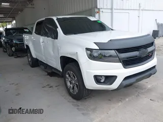 2020 Chevrolet Colorado 2WD Z71 with VIN 1GCGSDEN2L1159458, listed as a IAAI auction lot 42412924 with 90,011 mi miles and . Bid and sale history available at DreamBid. Image 1.