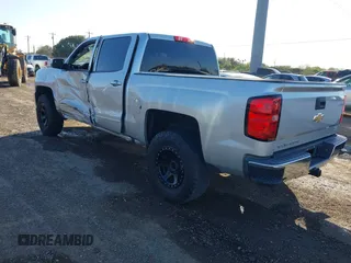 2018 Chevrolet Silverado 1500 LT with VIN 3GCPCREC9JG574686, listed as a IAAI auction lot 41676124 with 74,239 mi miles and . Bid and sale history available at DreamBid. Image 3.