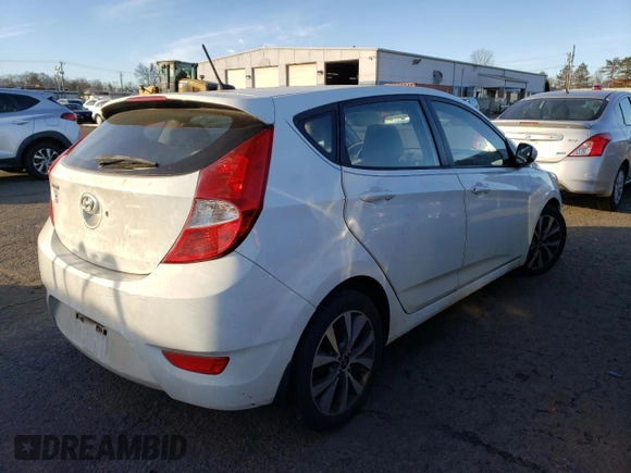 2015 Hyundai Accent Sport with VIN KMHCU5AE2FU217782, listed as a Copart auction lot 41446935 with 99,764 mi miles and Clean Title. Bid and sale history available at carsss.com. Image 3.