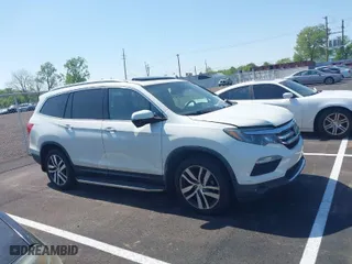 2017 Honda Pilot Touring with VIN 5FNYF5H96HB036547, listed as a IAAI auction lot 42058142 with 161,828 mi miles. Bid and sale history available at carsss.com. Image 13.