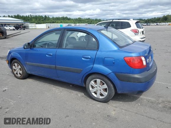 2009 Kia Rio LX with VIN KNADE223696530633, listed as a Copart auction lot 68371794 with 165,505 mi miles and Salvage Title. Bid and sale history available at DreamBid. Image 2.