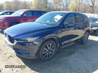 2018 Mazda CX-5 Grand Touring with VIN JM3KFADM1J0322049, listed as a IAAI auction lot 41891079 with 174,939 mi miles and . Bid and sale history available at DreamBid. Image 20.