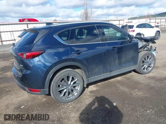 2019 Mazda CX-5 Signature with VIN JM3KFBEY5K0609063, listed as a IAAI auction lot 41802772 with 104,112 mi miles. Bid and sale history available at carsss.com. Image 4.