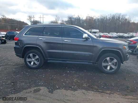 2014 Jeep Grand Cherokee Overland with VIN 1C4RJFCG5EC329377, listed as a IAAI auction lot 40822324 with 106,222 mi miles. Bid and sale history available at carsss.com. Image 14.
