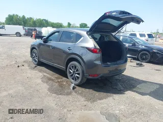 2018 Mazda CX-5 Touring with VIN JM3KFACM9J1348054, listed as a IAAI auction lot 42043458 with 120,177 mi miles. Bid and sale history available at carsss.com. Image 3.