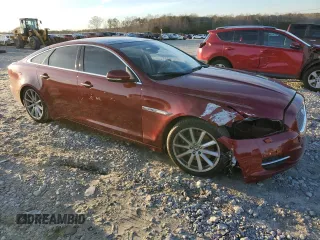2012 Jaguar XJ with VIN SAJWA1CB3CLV37685, listed as a Copart auction lot 87586005 with 59,885 mi miles and Salvage title. Bid and sale history available at DreamBid. Image 4.