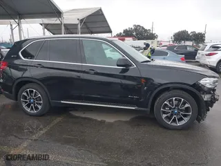 2018 BMW X5 xDrive40e iPerformance with VIN 5UXKT0C54J0V99573, listed as a IAAI auction lot 41490567 with 50,650 mi miles. Bid and sale history available at carsss.com. Image 14.