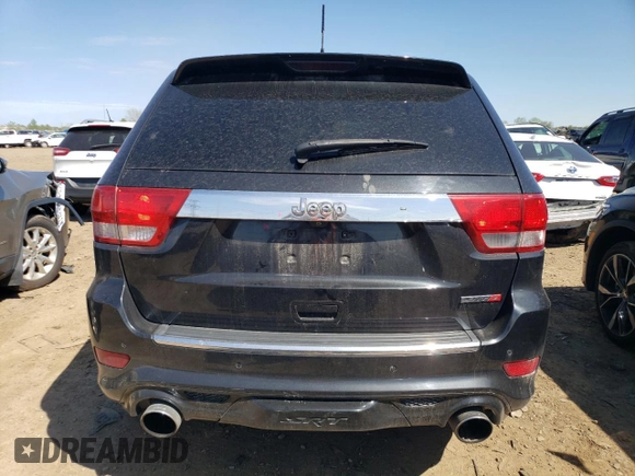 2012 Jeep Grand Cherokee SRT8 with VIN 1C4RJFDJ2CC352056, listed as a Copart auction lot 48810994 with 114,807 mi miles and Salvage Title. Bid and sale history available at carsss.com. Image 6.