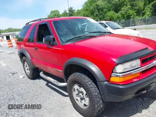 2001 Chevrolet Blazer LS z VIN 1GNCT18W71K113153, wystawiony jako IAAI lot #42297752 z przebiegiem Nie podano mil oraz . Historia ofert i sprzedaży dostępna na DreamBid. Obrazek 1.