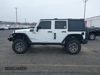2014 Jeep Wrangler Unlimited Rubicon with VIN 1C4BJWFGXEL283929, listed as a IAAI auction lot 41812052 with 137,790 mi miles and . Bid and sale history available at DreamBid. Image 14.