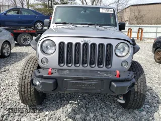 2015 Jeep Wrangler Unlimited Rubicon Hard Rock with VIN 1C4HJWFG4FL575054, listed as a Copart auction lot 51672655 with 130,405 mi miles and Clean title. Bid and sale history available at DreamBid. Image 5.