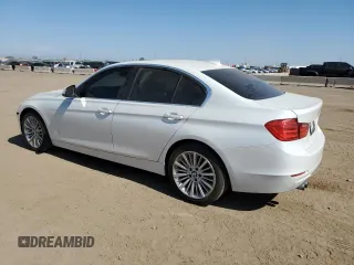 2013 BMW 3 Series 328i xDrive with VIN WBA3B3C51DF532714, listed as a Copart auction lot 57854735 with 140,650 mi miles and Salvage title. Bid and sale history available at DreamBid. Image 2.