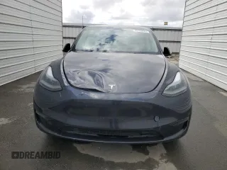 2024 Tesla Model Y with VIN 7SAYGDED4RF017614, listed as a Copart auction lot 45754675 with 11,209 mi miles and Salvage title. Bid and sale history available at DreamBid. Image 5.