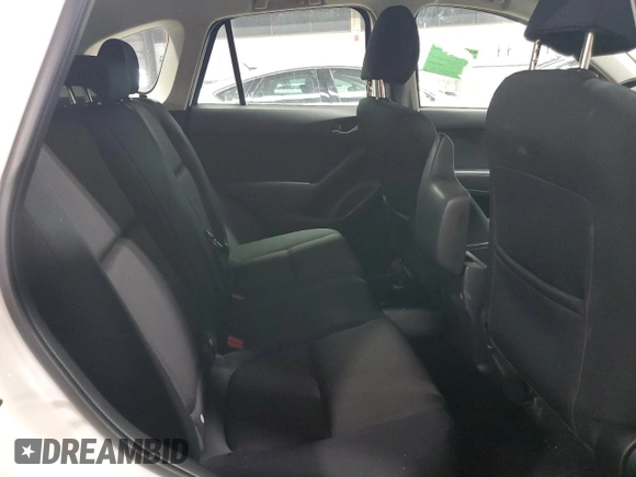 2016 Mazda CX-5 Sport with VIN JM3KE4BY9G0694709, listed as a Copart auction lot 55147555 with 98,900 mi miles and Salvage title. Bid and sale history available at DreamBid. Image 11.