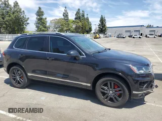 2016 Volkswagen Touareg Sport with VIN WVGEF9BP0GD007399, listed as a Copart auction lot 53990675 with 110,439 mi miles and Salvage Title. Bid and sale history available at DreamBid. Image 4.