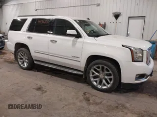 2015 GMC Yukon SLE with VIN 1GKS2AKC6FR103447, listed as a IAAI auction lot 41596220 with 104,209 mi miles. Bid and sale history available at carsss.com. Image 1.