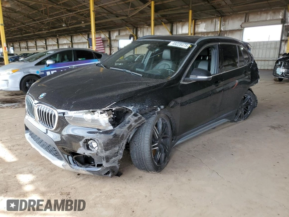 2018 BMW X1 sDrive28i with VIN WBXHU7C34J5L05725, listed as a Copart auction lot 49228475 with 69,994 mi miles and Salvage Title. Bid and sale history available at carsss.com. Image 1.
