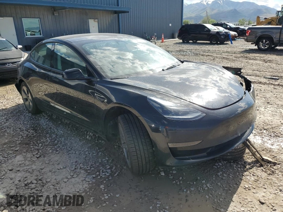 2023 Tesla Model 3 with VIN 5YJ3E1EAXPF708001, listed as a Copart auction lot 57252735 with 71,579 mi miles and Salvage title. Bid and sale history available at DreamBid. Image 4.