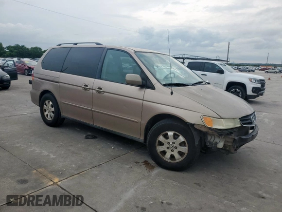 2004 Honda Odyssey EX-L with VIN 5FNRL18944B107051, listed as a Copart auction lot 58542335 with 207,951 mi miles and Salvage title. Bid and sale history available at DreamBid. Image 4.
