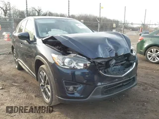 2016 Mazda CX-5 Grand Touring with VIN JM3KE4DY1G0823989, listed as a IAAI auction lot 41770149 with 40,677 mi miles. Bid and sale history available at carsss.com. Image 1.