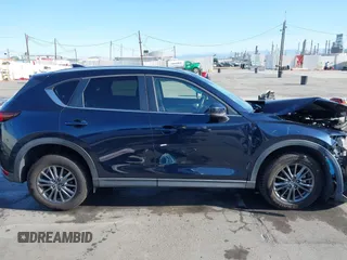 2019 Mazda CX-5 Touring with VIN JM3KFACM7K1534905, listed as a IAAI auction lot 41945607 with 56,014 mi miles. Bid and sale history available at carsss.com. Image 14.