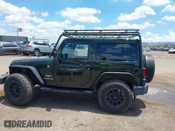 2012 Jeep Wrangler Sahara z VIN 1C4AJWBGXCL100527, wystawiony jako IAAI lot #42394623 z przebiegiem 126 097 mil mil oraz . Historia ofert i sprzedaży dostępna na DreamBid. Obrazek 14.