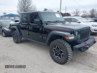 2022 Jeep Gladiator Rubicon z VIN 1C6JJTBG7NL145501, wystawiony jako IAAI lot #41506842 z przebiegiem 20 593 mil mil oraz . Historia ofert i sprzedaży dostępna na DreamBid. Obrazek 1.