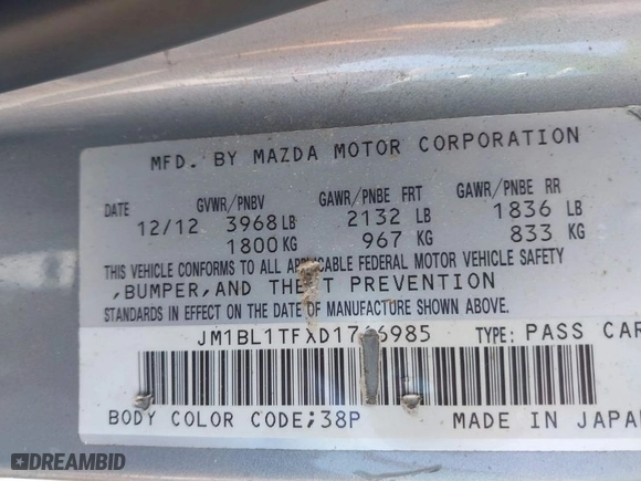 2013 Mazda Mazda3 i SV with VIN JM1BL1TFXD1766985, listed as a IAAI auction lot 42033758 with 144,018 mi miles. Bid and sale history available at carsss.com. Image 9.