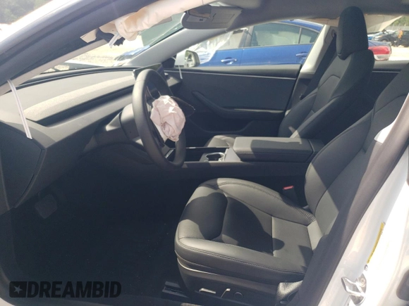 2025 Tesla Model 3 Long Range with VIN 5YJ3E1EA3SF889774, listed as a Copart auction lot 57493425 with 5,167 mi miles and Salvage title. Bid and sale history available at DreamBid. Image 7.