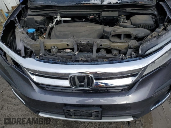 2020 Honda Pilot Touring 7-Passenger with VIN 5FNYF6H60LB039609, listed as a Copart auction lot 51753425 with 57,512 mi miles and Salvage title. Bid and sale history available at DreamBid. Image 12.