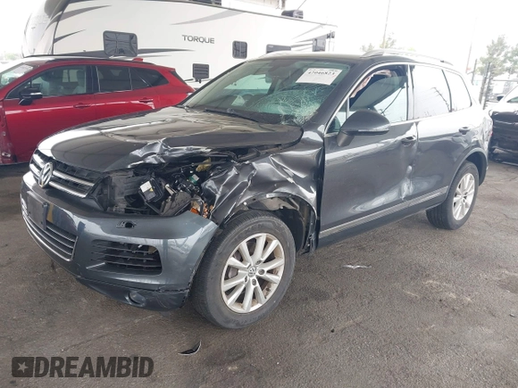 2014 Volkswagen Touareg Sport with VIN WVGEF9BP0ED015273, listed as a IAAI auction lot 42046823 with 84,694 mi miles and . Bid and sale history available at DreamBid. Image 17.