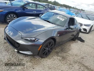 2024 Mazda MX-5 Miata Grand Touring z VIN JM1NDAM73R0603254, wystawiony jako Copart lot #74551704 z przebiegiem Nie podano mil oraz Nie do naprawy • Non repairable. Historia ofert i sprzedaży dostępna na DreamBid. Obrazek 1.