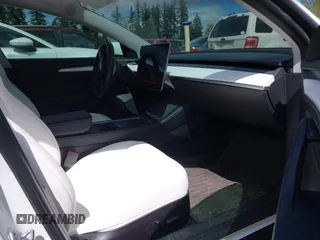 2021 Tesla Model 3 Performance with VIN 5YJ3E1EC2MF096681, listed as a IAAI auction lot 42068782 with 34,852 mi miles and . Bid and sale history available at DreamBid. Image 5.