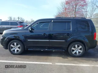 2012 Honda Pilot Touring with VIN 5FNYF4H96CB041380, listed as a IAAI auction lot 41941615 with 137,537 mi miles and . Bid and sale history available at DreamBid. Image 14.