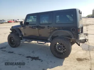 2013 Jeep Wrangler Unlimited Freedom z VIN 1C4BJWDG0DL513902, wystawiony jako Copart lot #52045975 z przebiegiem 166 827 mil mil oraz Szkoda całkowita • Salvage title. Historia ofert i sprzedaży dostępna na DreamBid. Obrazek 2.