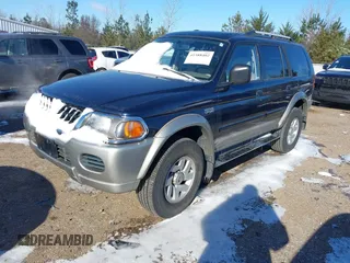 2004 Mitsubishi Montero Sport XLS with VIN JA4MT31R34J008532, listed as a IAAI auction lot 41588402 with 113,546 mi miles. Bid and sale history available at carsss.com. Image 2.