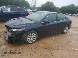 2018 Toyota Camry LE с VIN 4T1B11HK7JU573632, выставлен на аукционе Copart как лот 56761165 с пробегом 145 485 миль миль и Списание • Salvage title. История ставок и продаж доступна на DreamBid. Изображение 1.