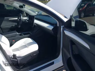2024 Tesla Model Y with VIN 7SAYGDED9RF161420, listed as a IAAI auction lot 41892788 with 12,353 mi miles and . Bid and sale history available at DreamBid. Image 5.