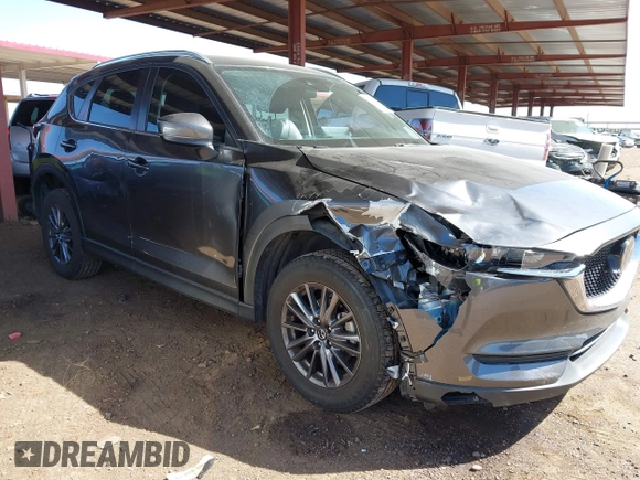 2021 Mazda CX-5 Touring with VIN JM3KFACM2M1313750, listed as a IAAI auction lot 41762938 with 68,503 mi miles. Bid and sale history available at carsss.com. Image 1.