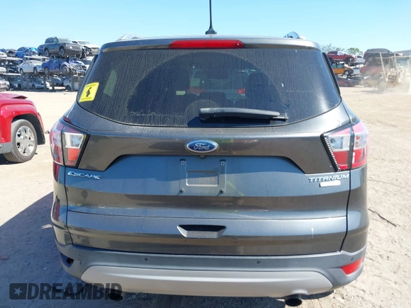 2018 Ford Escape Titanium with VIN 1FMCU0J99JUB09562, listed as a IAAI auction lot 41547659 with 63,700 mi miles and . Bid and sale history available at DreamBid. Image 16.