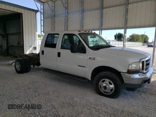 2002 Ford F-350 with VIN 1FDWW37F42EB55737, listed as a Copart auction lot 73678434 with 233,366 mi miles and Salvage title. Bid and sale history available at DreamBid. Image 4.