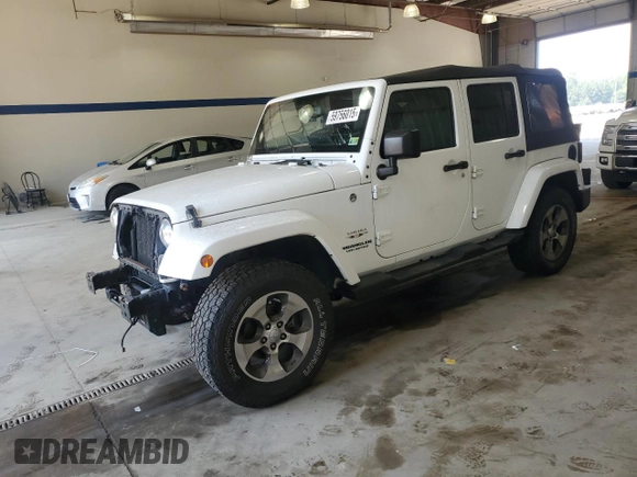 2016 Jeep Wrangler Unlimited Sahara with VIN 1C4BJWEGXGL310499, listed as a Copart auction lot 59756015 with 128,498 mi miles and Salvage title. Bid and sale history available at DreamBid. Image 1.