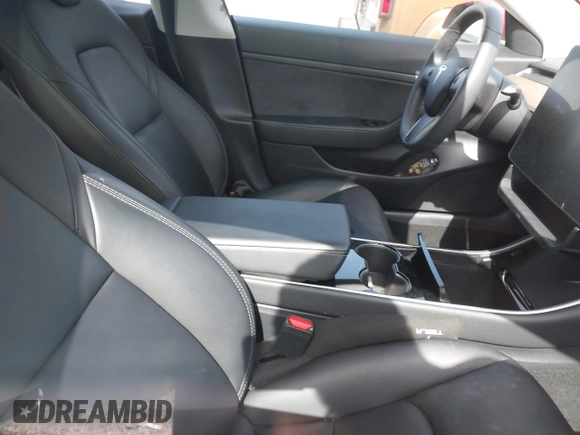 2020 Tesla Model 3 Standard Range Plus with VIN 5YJ3E1EA9LF708808, listed as a IAAI auction lot 40018323 with 32,069 mi miles. Bid and sale history available at carsss.com. Image 5.