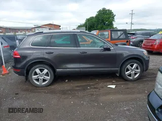 2012 Volkswagen Touareg Sport with VIN WVGFK9BP0CD002939, listed as a IAAI auction lot 42531654 with 222,435 mi miles and . Bid and sale history available at DreamBid. Image 13.