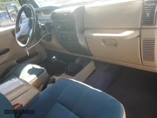 1999 Jeep Wrangler Sahara with VIN 1J4FY49S6XP478675, listed as a Copart auction lot 52147605 with 157,971 mi miles and Salvage Title. Bid and sale history available at carsss.com. Image 8.