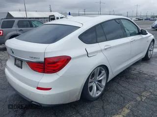 2011 BMW 5 Series GT 550i with VIN WBASN4C59BC210040, listed as a IAAI auction lot 42140088 with 130,771 mi miles. Bid and sale history available at carsss.com. Image 4.