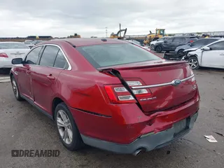 2015 Ford Taurus SEL with VIN 1FAHP2E8XFG137526, listed as a IAAI auction lot 41909658 with 147,992 mi miles and . Bid and sale history available at carsss.com. Image 3.